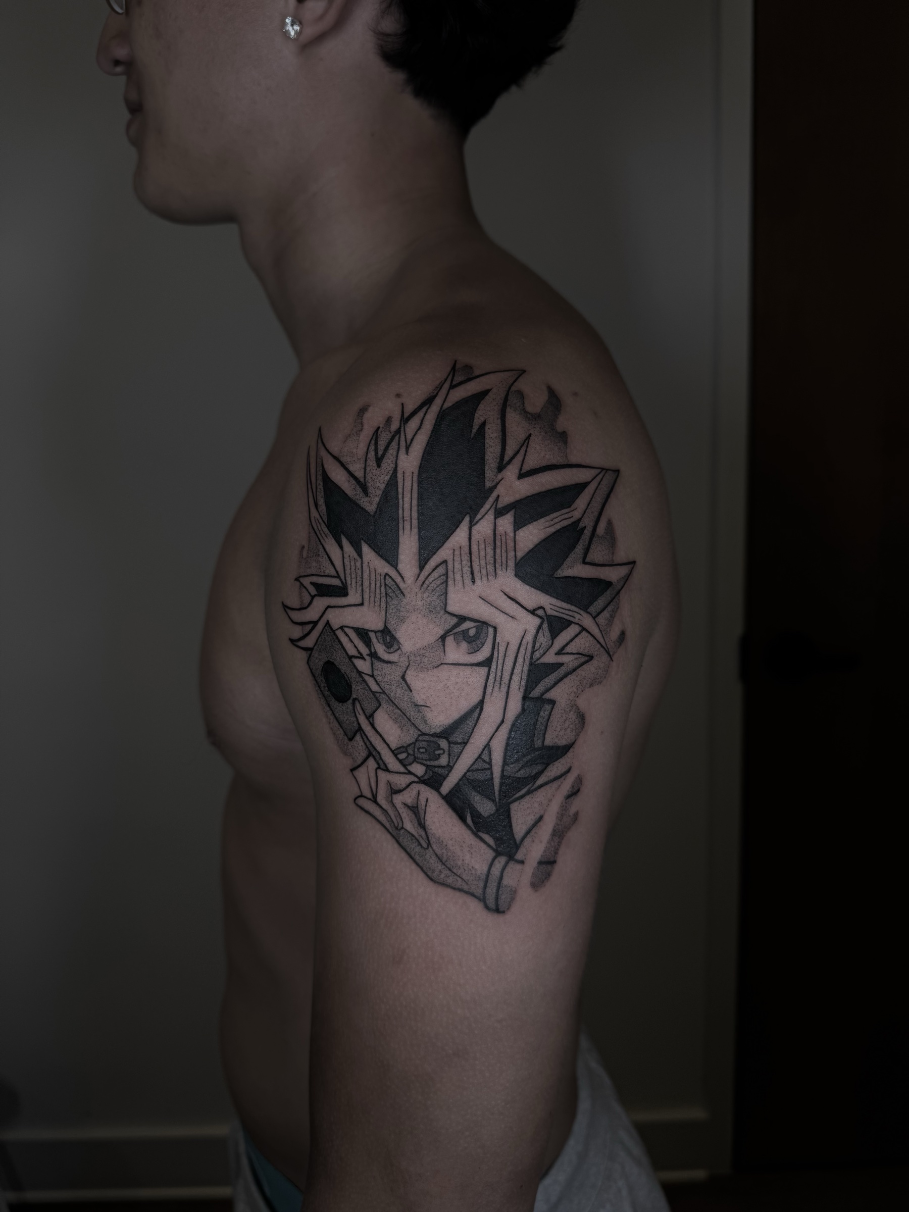 Black and grey anime tattoo by Danny Flores